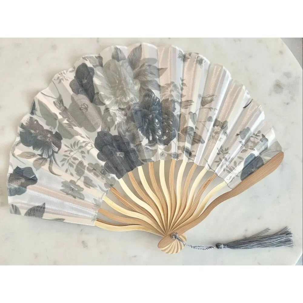 Gray and white floral hand fan